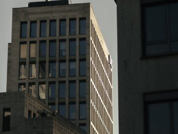 View of modern high-rise buildings in Frankfurt during sunset, showcasing urban architecture.