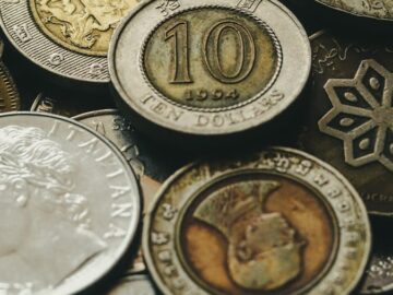 A collection of various international coins displaying different currencies and designs.