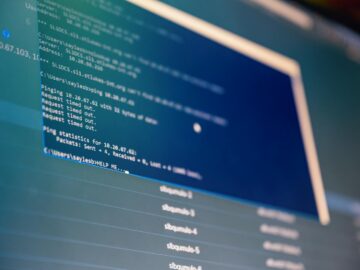 Close-up of digital data analysis displayed on a computer monitor with blue tones.