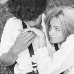 Emotional black and white portrait of a couple embracing in nature.