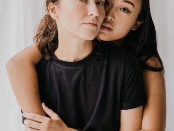 Portrait of an affectionate couple embracing, highlighting love and diversity.