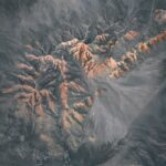 A stunning aerial view of rocky terrain showcasing rugged natural formations and peaceful scenery.