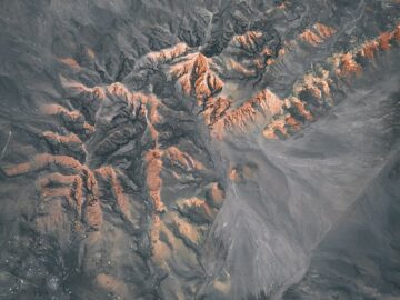 A stunning aerial view of rocky terrain showcasing rugged natural formations and peaceful scenery.