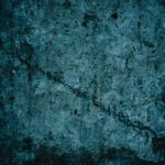 A detailed vintage grunge texture with dark tones, perfect for artistic backgrounds and design elements.