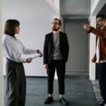 Colleagues in an office having a focused discussion about project plans.