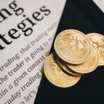 Close-up of gold Bitcoin coins on a trading document, symbolizing investment and cryptocurrency market strategies.