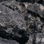 High-resolution close-up of textured gray rocks, showcasing natural patterns and rugged beauty.