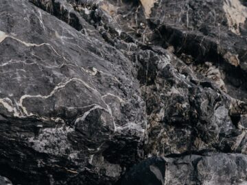 High-resolution close-up of textured gray rocks, showcasing natural patterns and rugged beauty.