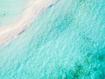 Stunning aerial shot of turquoise waters and sandy beach in Dependencias Federales Venezolanas, Venezuela.