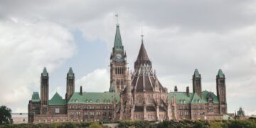 Stunning view of the Gothic Revival Parliament Hill buildings in Ottawa during summer.
