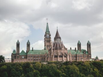 Stunning view of the Gothic Revival Parliament Hill buildings in Ottawa during summer.