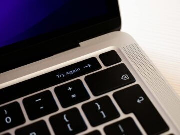 High-resolution close-up of a laptop keyboard featuring a 'Try Again' button.