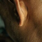 Detailed close-up view of a human ear showing skin texture for medical and anatomical study.