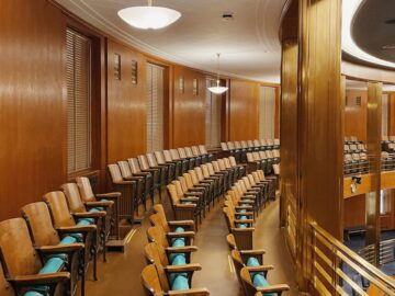 Captivating view of a government chamber with elegant wood paneling and seating arrangement in Bismarck, ND.