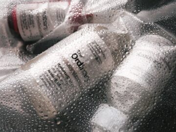 Skincare products by The Ordinary, encapsulated in a moisture-rich setup, highlighting hydration.