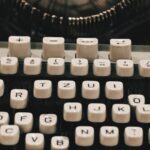 Detailed close-up of a vintage typewriter keyboard showcasing retro design.
