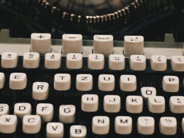 Detailed close-up of a vintage typewriter keyboard showcasing retro design.