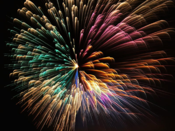 Colorful fireworks burst illuminating the night sky, perfect for celebrations.