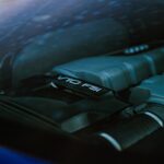 Detailed view of a powerful V10 FSI sports car engine under glass.