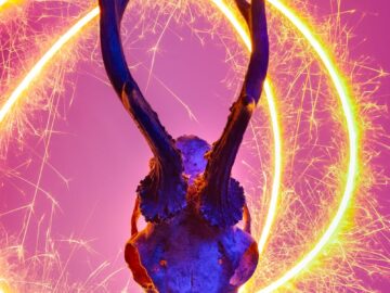 Deer skull with glowing horn illumination and vibrant sparklers.