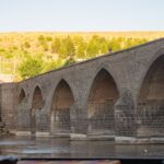 Scenic view of the ancient Dicle Bridge over the Tigris River in Diyarbakir, Turkey.