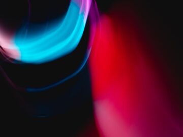 Vibrant abstract image of colorful light streaks creating a dynamic, futuristic effect.