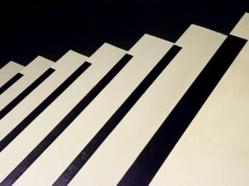 Creative abstract pattern resembling piano keys or stairs in black and white tones.