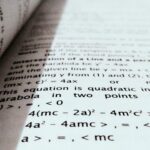 A close-up shot of mathematical equations on a book page, perfect for education and learning concepts.