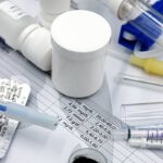 Close-up of medical supplies and test results related to veterinary care and pet health.