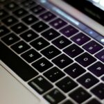 Detailed close-up of a modern laptop keyboard, highlighting the keys and sleek design.