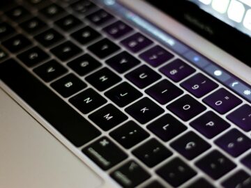 Detailed close-up of a modern laptop keyboard, highlighting the keys and sleek design.