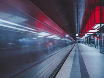 A swift train in a modern subway station, capturing the essence of speed and technology.