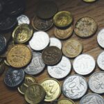Close-up view of various Polish coins on a wooden table showcasing currency and finance concepts.