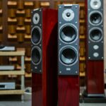 Luxury wooden speakers in an acoustically optimized room, perfect for audiophiles.