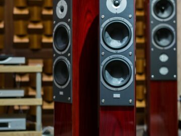 Luxury wooden speakers in an acoustically optimized room, perfect for audiophiles.