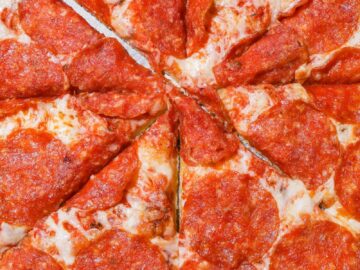 Close-up of a cheesy pepperoni pizza with mouth-watering toppings.