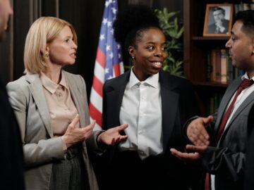 Colleagues in a professional meeting discussing strategies indoors.