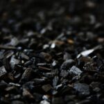 Detailed close-up of charcoal briquettes showing textures and shades.