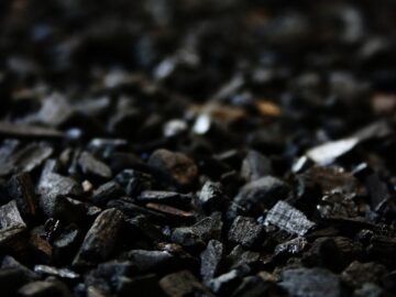 Detailed close-up of charcoal briquettes showing textures and shades.