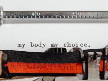 Close-up of a vintage typewriter typing 'my body my choice.'