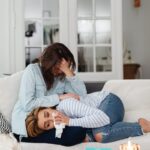 Two women sharing a heartfelt moment, conveying support and understanding.