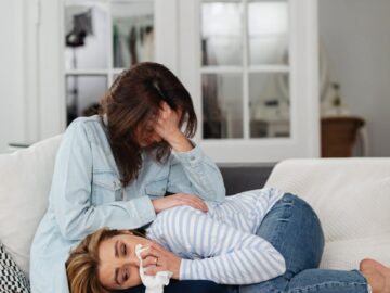 Two women sharing a heartfelt moment, conveying support and understanding.