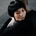 A poignant embrace depicting emotional connection and unity between two people.