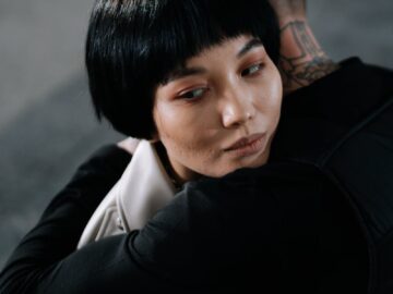 A poignant embrace depicting emotional connection and unity between two people.