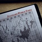 Close-up view of a world time zone map printed on paper inside a diary.