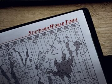 Close-up view of a world time zone map printed on paper inside a diary.