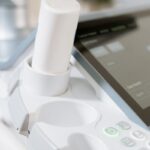 Detailed view of an ultrasound scanner in a healthcare setting.