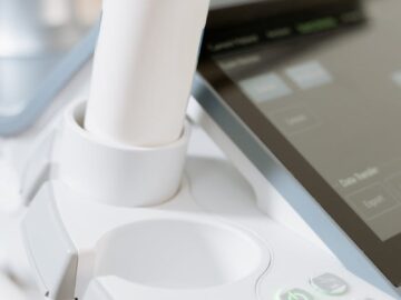 Detailed view of an ultrasound scanner in a healthcare setting.