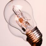 Detailed image of a classic clear incandescent bulb, encapsulating energy and innovation concepts.