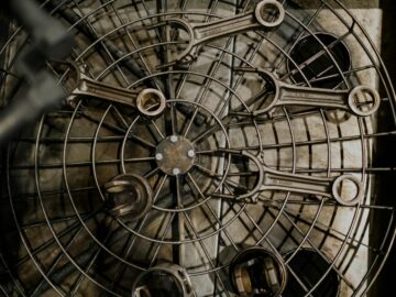 Top view of metal wrenches arranged on a grid in an industrial setting.